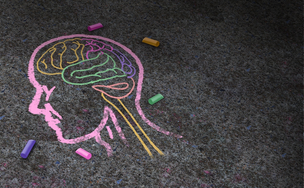 chalk illustration of human brain inside head