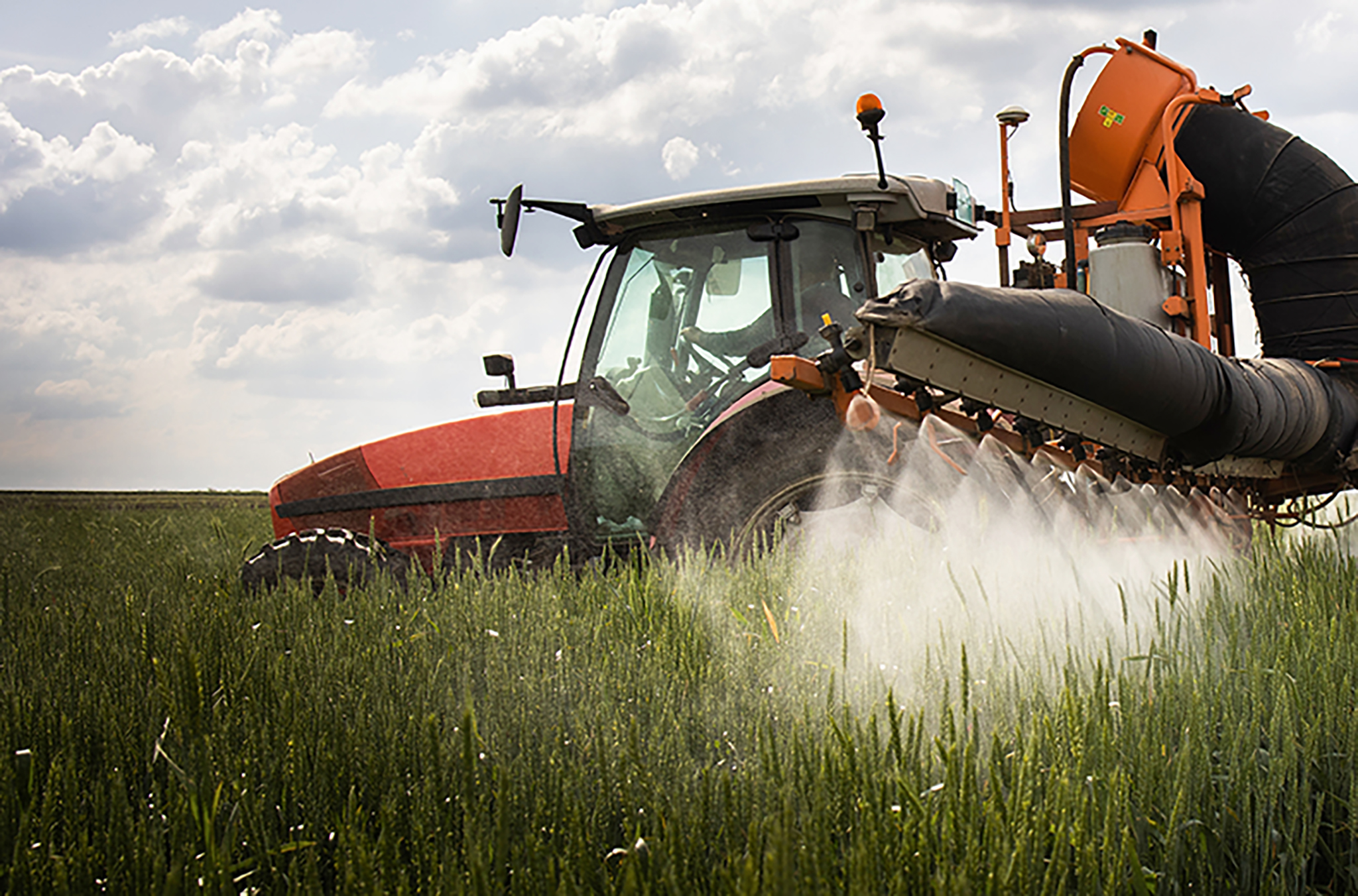 Tractor-spraying-pesticide-over-crops-2048x1352